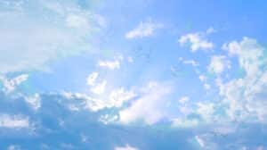 Eye floaters pictured against a bright blue sky