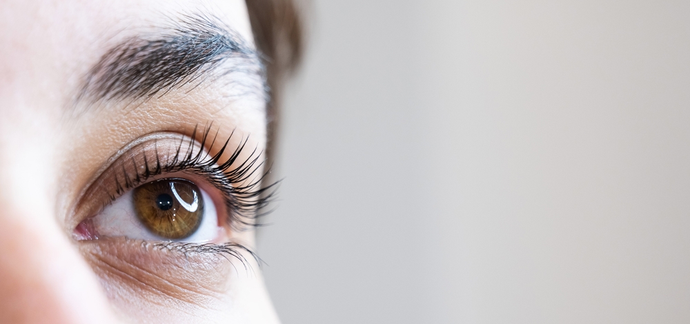 Brookfield man rubs his eye after experiencing symptoms of glaucoma Close-up of an eye during a vision evaluation for early cataract detection