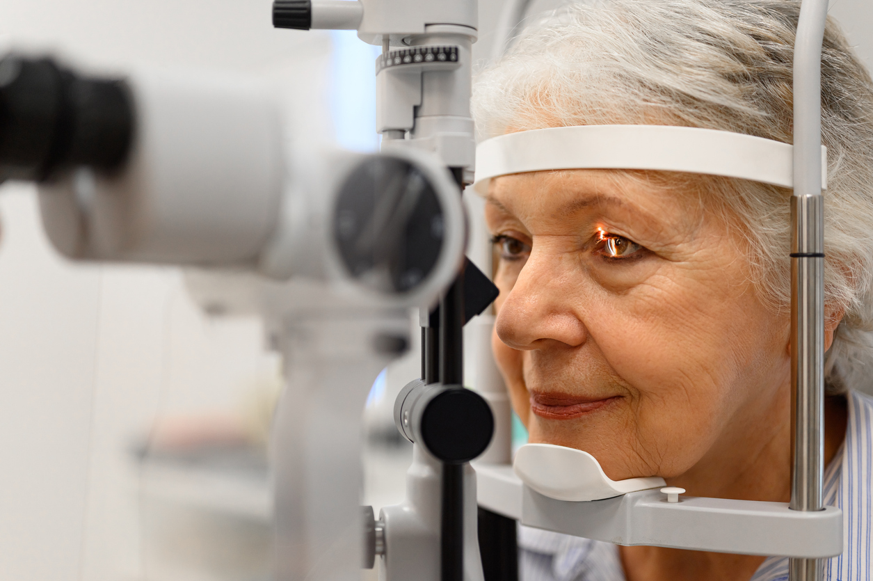Brookfield man rubs his eye after experiencing symptoms of glaucoma Older woman undergoing an eye exam to evaluate flashes of light in her vision.